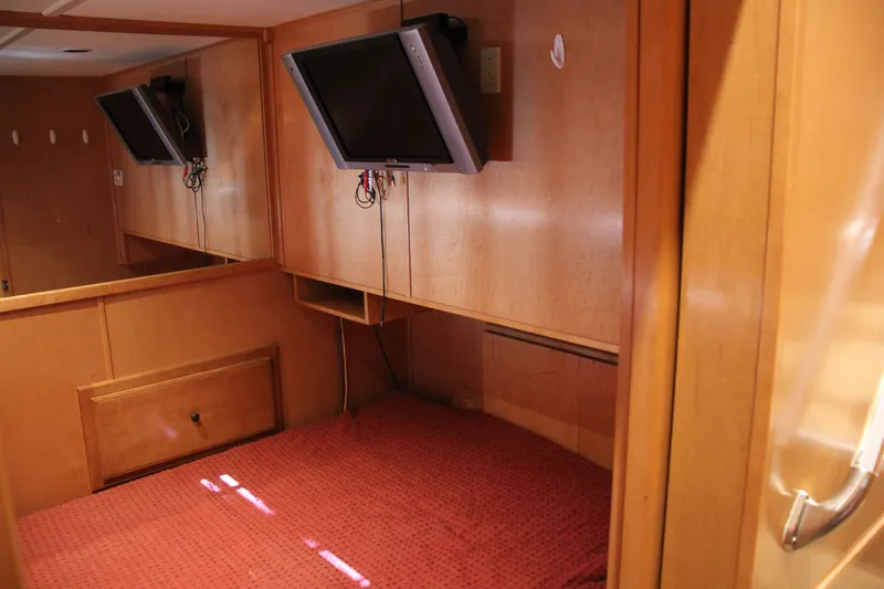 Slide: The Image of 2007 Sumerset Steel Away interior with mounted TV and wooden paneling. - 6