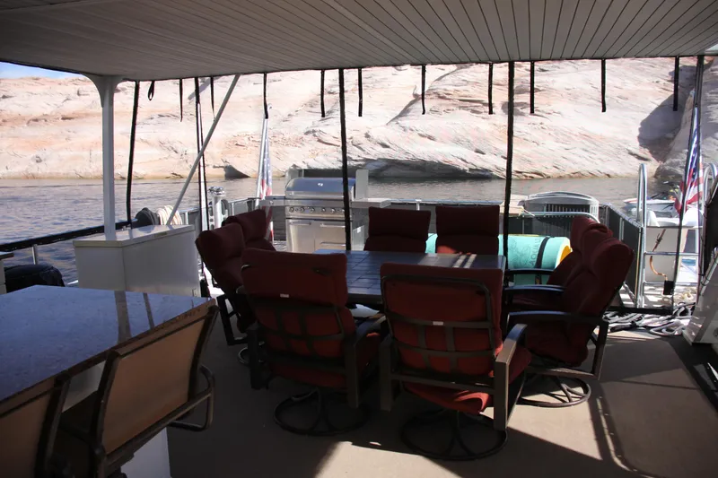 Slide: The Image of Luxurious 2007 Sumerset Steel Away houseboat with outdoor seating and grill, scenic water view. - 9