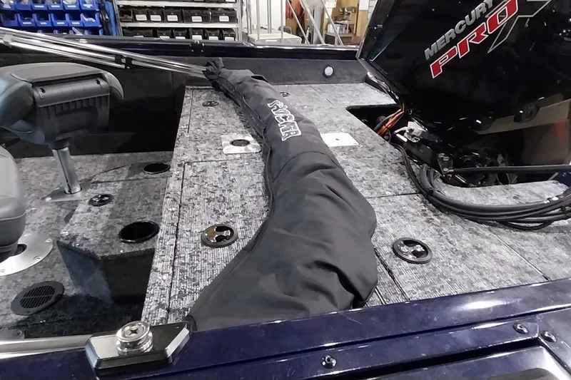 Slide: The Image of 2025 Tracker Targa V-19 WT boat interior with Mercury Pro engine and seating. - 13