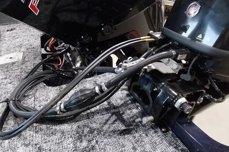 Slide: The Image of 2025 Tracker Targa V-19 WT boat engine with cables and components visible. - 15