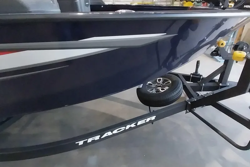Slide: The Image of 2025 Tracker Targa V-19 WT boat on trailer, showcasing sleek design and modern features. - 2