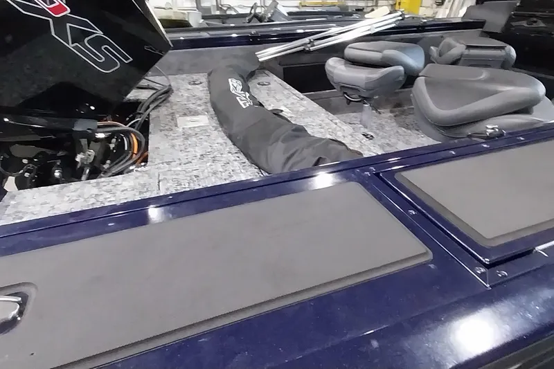 Slide: The Image of 2025 Tracker Targa V-19 WT boat interior with seating and motor details. - 35