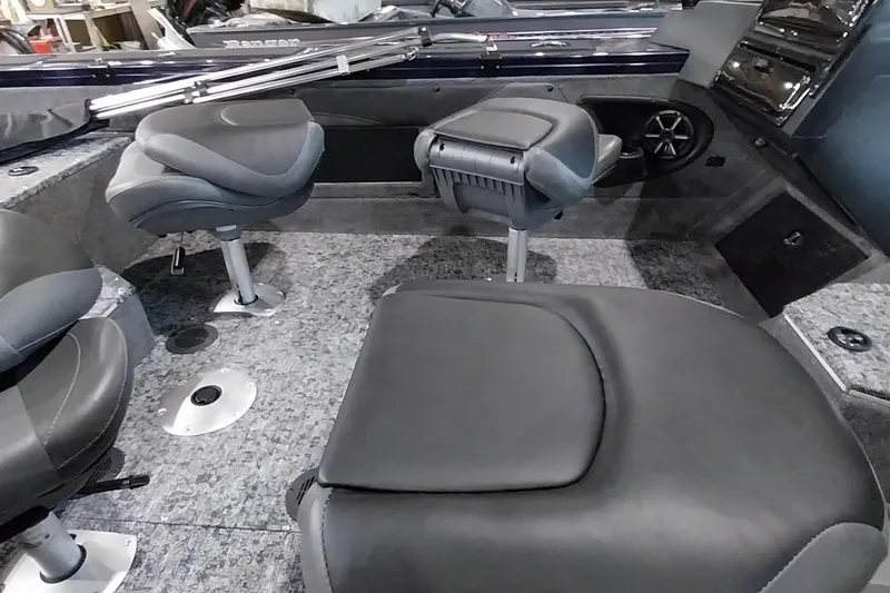 Slide: The Image of 2025 Tracker Targa V-19 WT boat interior with cushioned seating and carpeted flooring. - 40