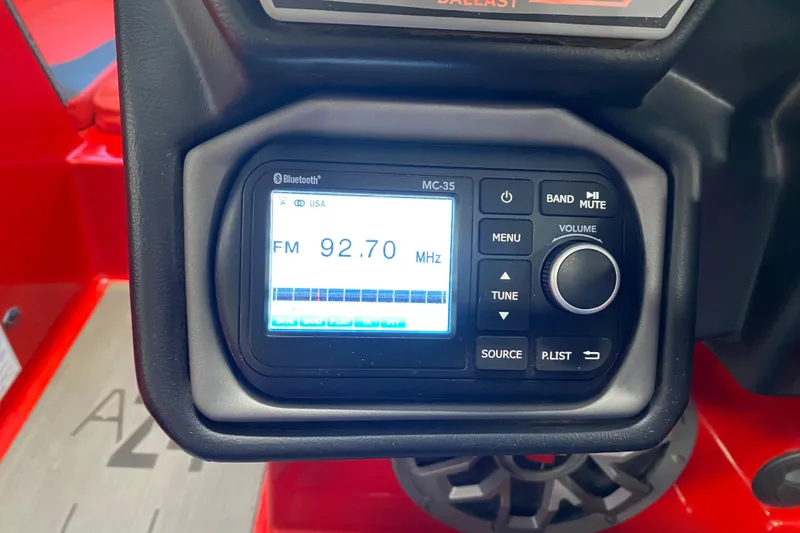 Slide: The Image of Close-up of a 2019 Axis A24 boat radio display showing FM 92.70 MHz. - 10