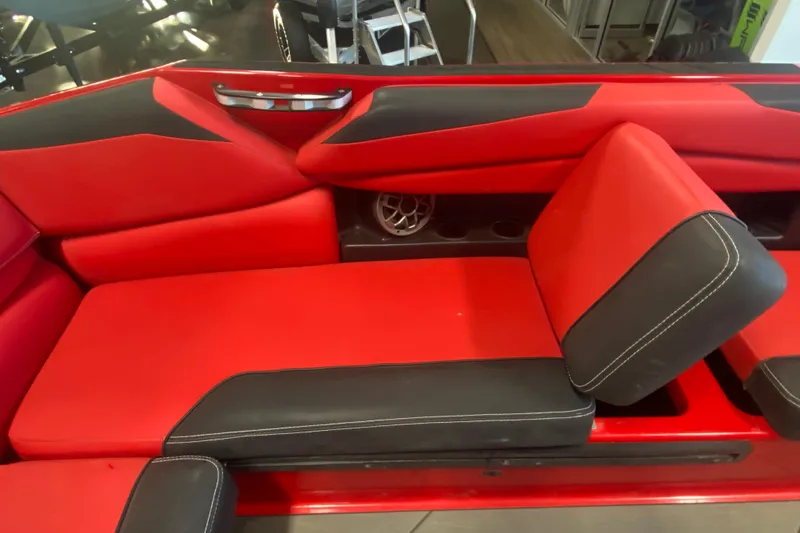 Slide: The Image of Red and black interior seating of 2019 Axis A24 boat, featuring modern design. - 13