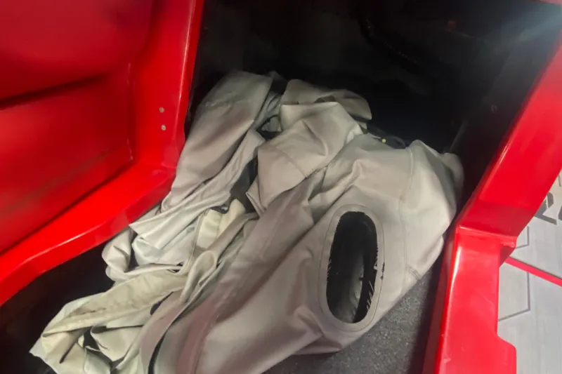 Slide: The Image of Red compartment of 2019 Axis A24 boat with gray fabric inside. - 14