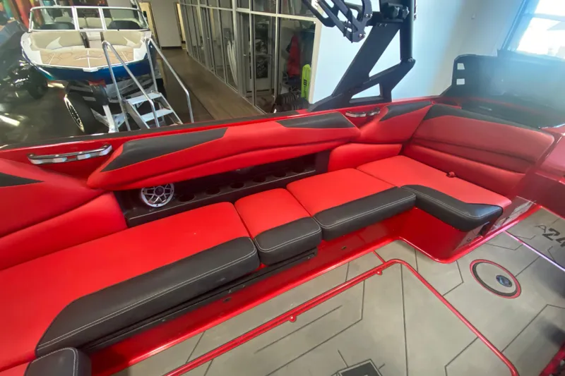 Slide: The Image of 2019 Axis A24 boat interior with red and black seating, modern design. - 15