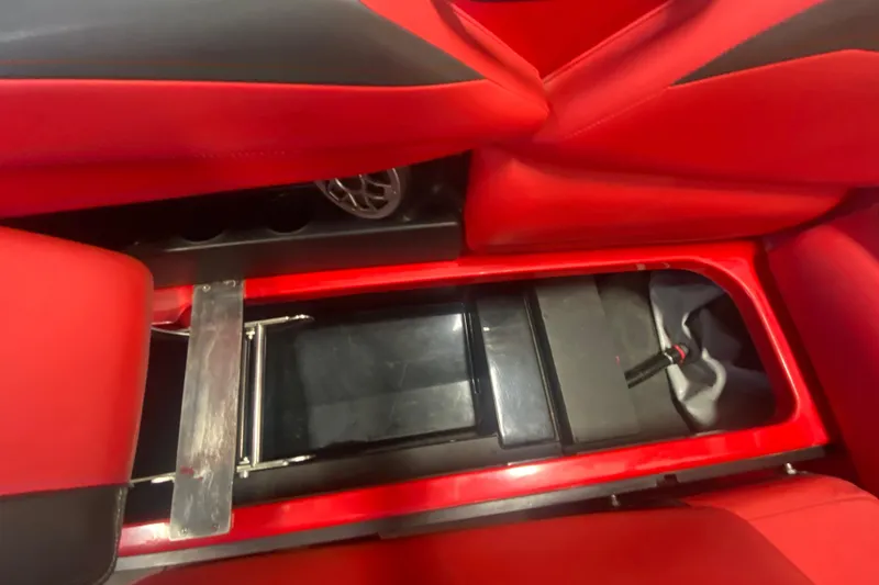 Slide: The Image of Red interior storage compartment of 2019 Axis A24 boat. - 17