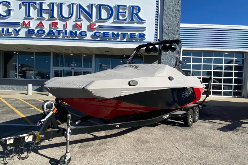 Slide: The Image of 2019 Axis A24 boat covered on trailer at Big Thunder Marine center. - 31