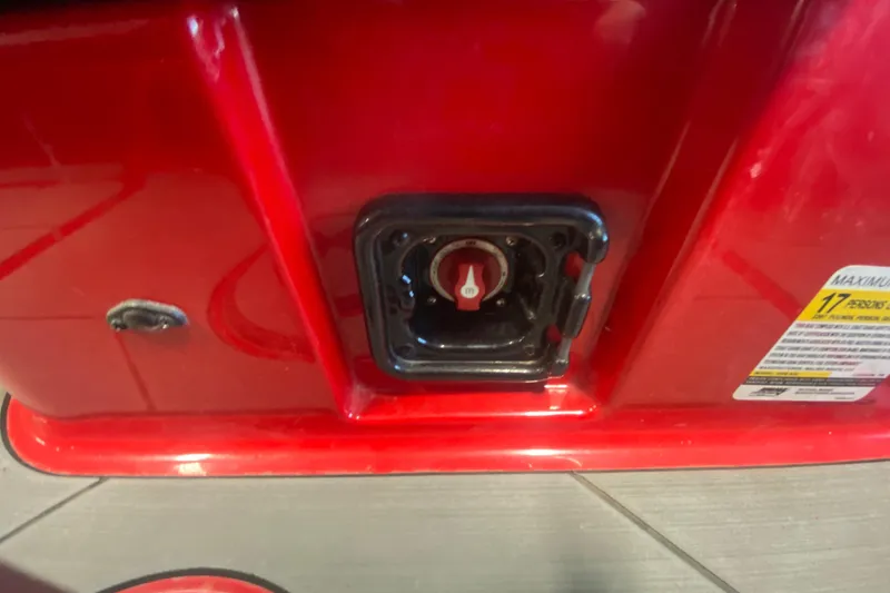 Slide: The Image of Red 2019 Axis A24 boat detail with control knob and safety label. - 4