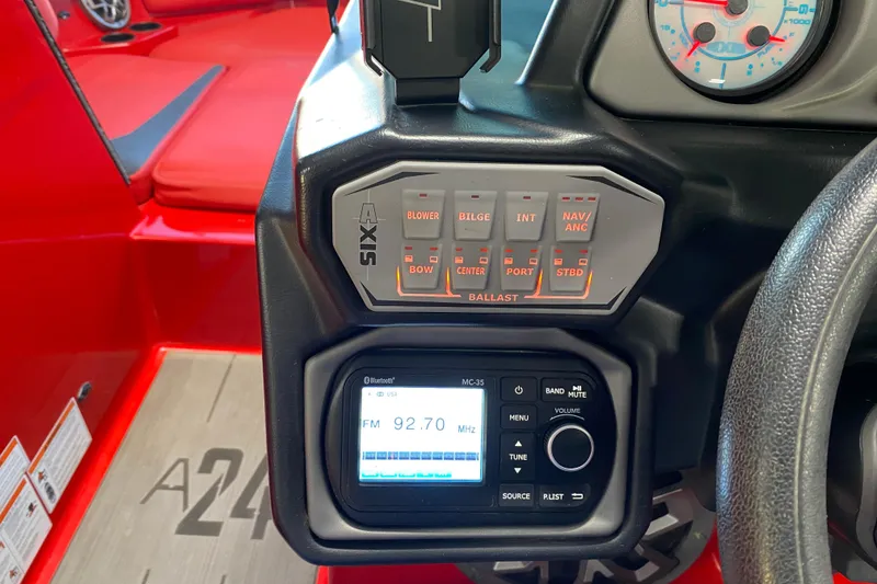 Slide: The Image of 2019 Axis A24 boat dashboard with control panel and radio display. - 7