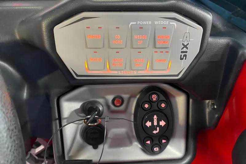Slide: The Image of Control panel of a 2019 Axis A24 boat with illuminated buttons and switches. - 8