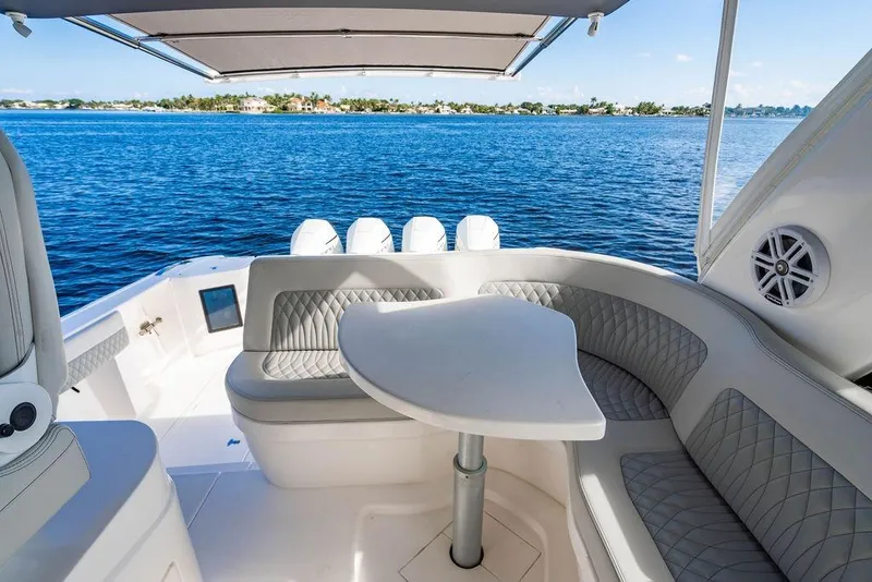 Slide: The Image of Luxurious seating area on 2022 Intrepid 477 Evolution yacht with ocean view. - 14