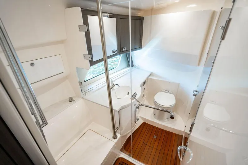 Slide: The Image of Luxurious bathroom in 2022 Intrepid 477 Evolution yacht with modern fixtures and wooden flooring. - 24