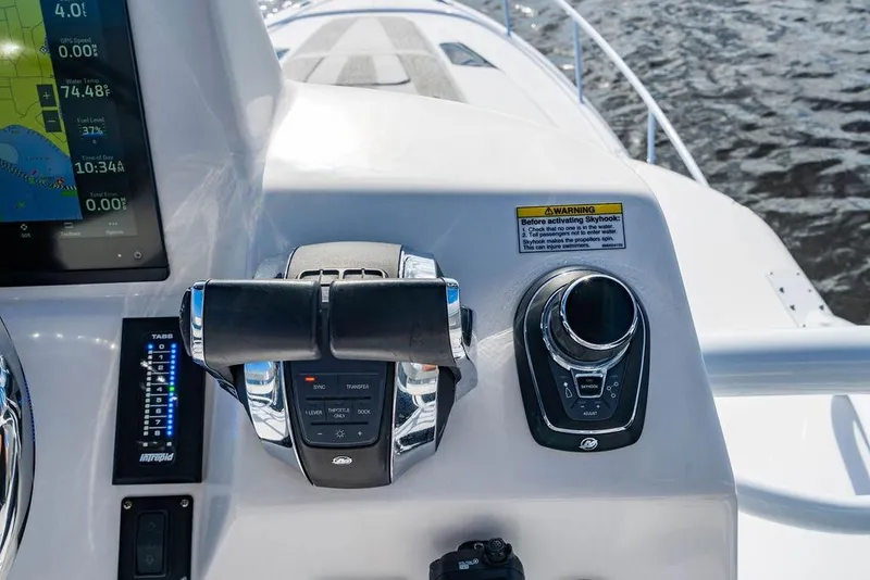 Slide: The Image of Control panel of a 2022 Intrepid 477 Evolution boat with navigation display. - 27