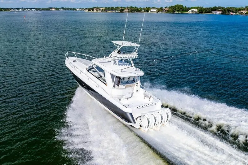 Slide: The Image of 2022 Intrepid 477 Evolution cruising on open water, showcasing sleek design and powerful engines. - 29