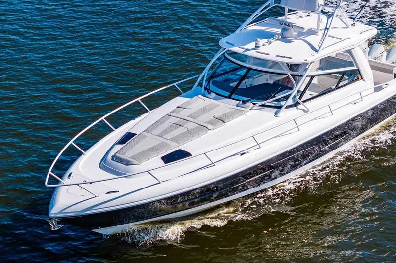Slide: The Image of 2022 Intrepid 477 Evolution cruising on open water, showcasing sleek design and luxury features. - 3