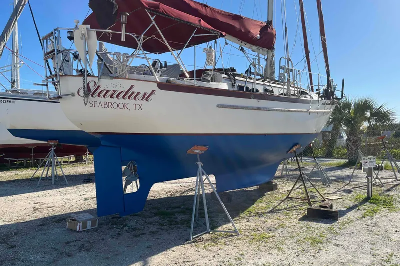 Slide: The Image of 1990 Pacific Seacraft 34 Voyager sailboat named "Stardust" on stands in Seabrook, TX. - 2