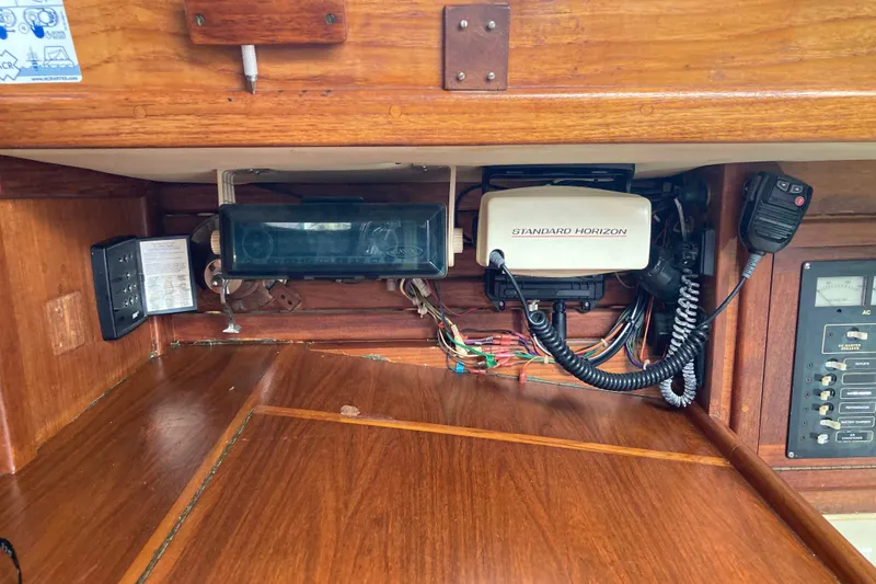 Slide: The Image of 1990 Pacific Seacraft 34 Voyager navigation equipment with Standard Horizon radio and control panel. - 23