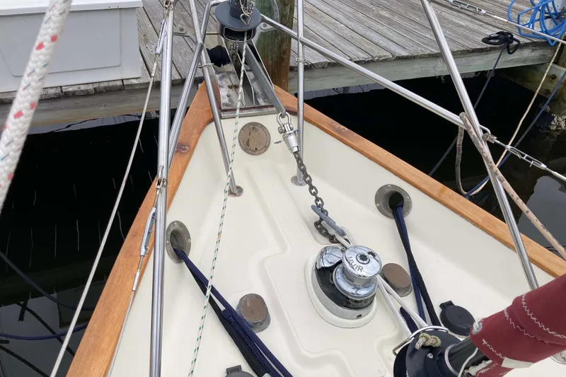 Slide: The Image of Bow of 1990 Pacific Seacraft 34 Voyager sailboat with anchor chain and winch. - 6