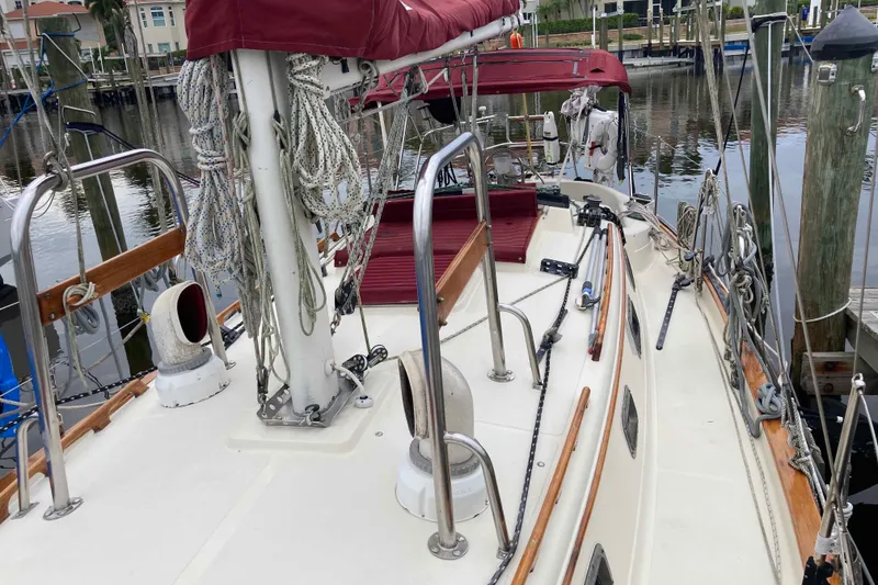 Slide: The Image of 1990 Pacific Seacraft 34 Voyager sailboat docked, featuring deck and rigging details. - 8