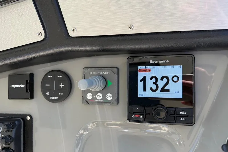 Slide: The Image of Control panel of 2006 Cruisers Yachts 415 Express Motoryacht with Raymarine display. - 13