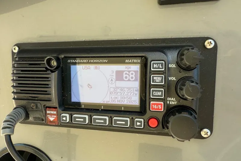 Slide: The Image of Standard Horizon Matrix radio on 2006 Cruisers Yachts 415 Express Motoryacht dashboard. - 14