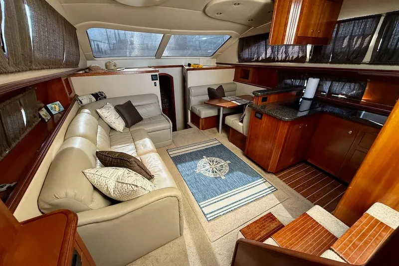 Slide: The Image of Luxurious interior of 2006 Cruisers Yachts 415 Express Motoryacht with leather seating and wood finishes. - 17