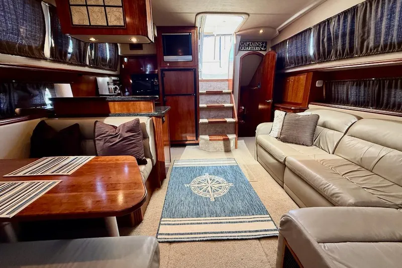 Slide: The Image of Luxurious interior of 2006 Cruisers Yachts 415 Express Motoryacht with elegant seating and dining area. - 18