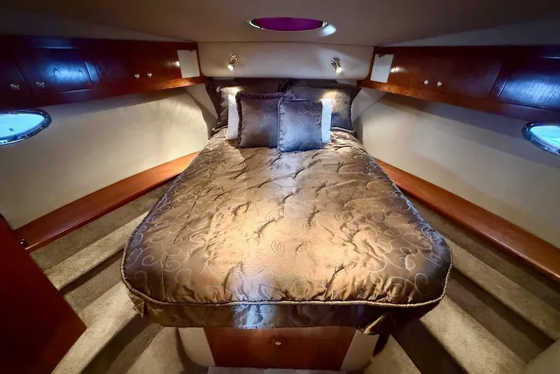 Slide: The Image of Luxurious cabin interior of 2006 Cruisers Yachts 415 Express Motoryacht with elegant bedding. - 24
