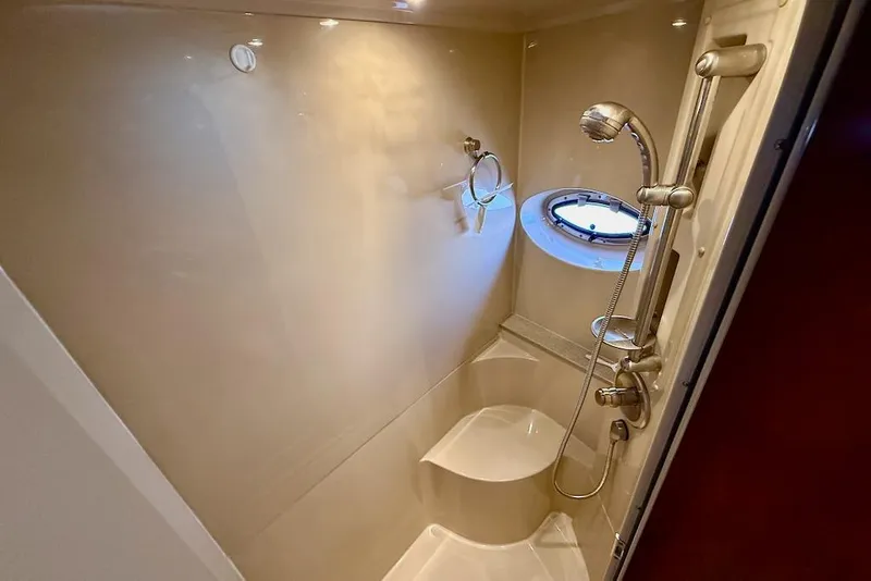 Slide: The Image of Luxurious bathroom in 2006 Cruisers Yachts 415 Express Motoryacht with shower and porthole. - 27