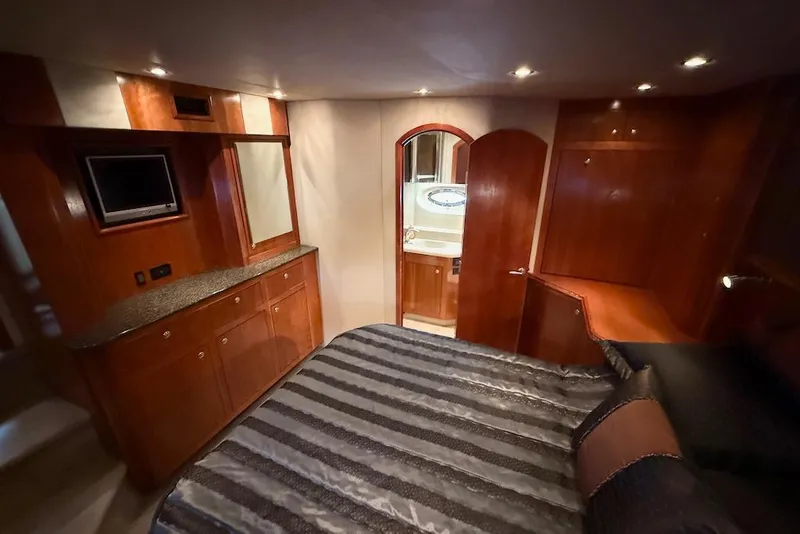 Slide: The Image of Luxurious 2006 Cruisers Yachts 415 Express Motoryacht interior with elegant wood finishes. - 29