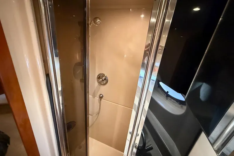 Slide: The Image of Shower area in 2006 Cruisers Yachts 415 Express Motoryacht, featuring sleek design and chrome fixtures. - 31