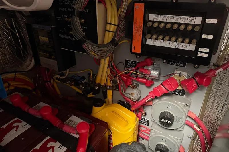 Slide: The Image of Electrical panel and wiring inside a 2006 Cruisers Yachts 415 Express Motoryacht engine room. - 38