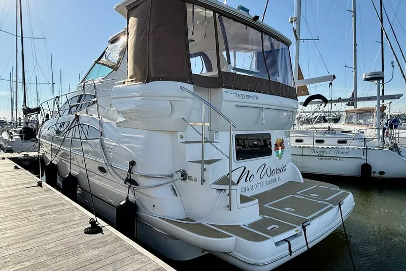 Slide: The Image of 2006 Cruisers Yachts 415 Express Motoryacht docked at marina, rear view. - 5