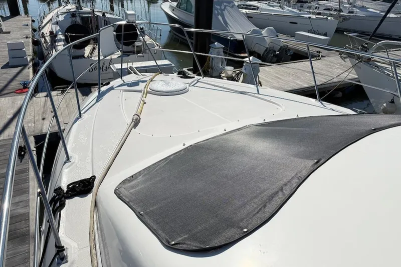 Slide: The Image of 2006 Cruisers Yachts 415 Express Motoryacht docked at marina, top deck view. - 7