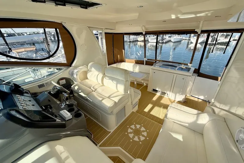 Slide: The Image of Luxurious interior of 2006 Cruisers Yachts 415 Express Motoryacht with plush seating and helm. - 9