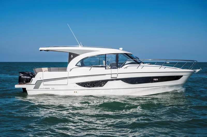 The Image of 2026 Beneteau Antares 11 Coupe cruising on open water under clear blue skies. - 0