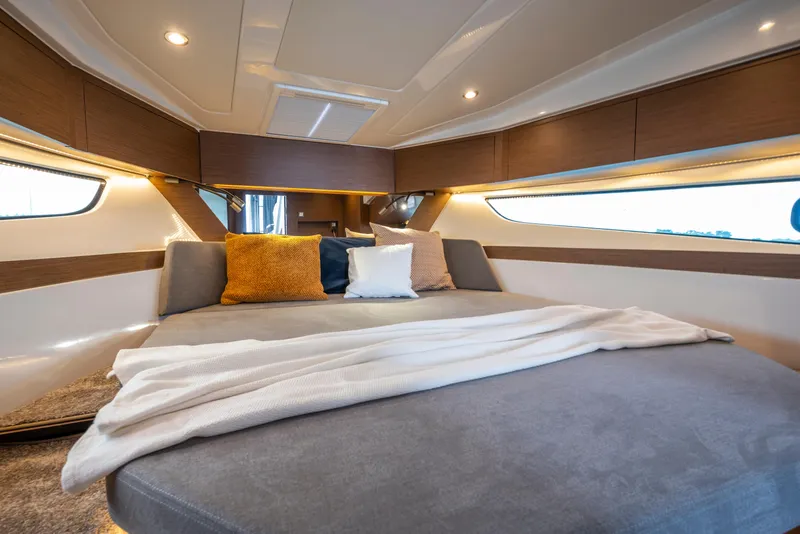 Slide: The Image of Luxurious interior of 2026 Beneteau Antares 11 Coupe with cozy bedding and modern design. - 19