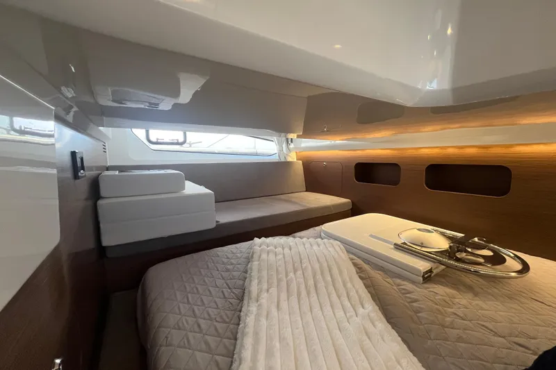 Slide: The Image of Luxurious cabin interior of 2026 Beneteau Antares 11 Coupe with modern design and cozy bedding. - 22