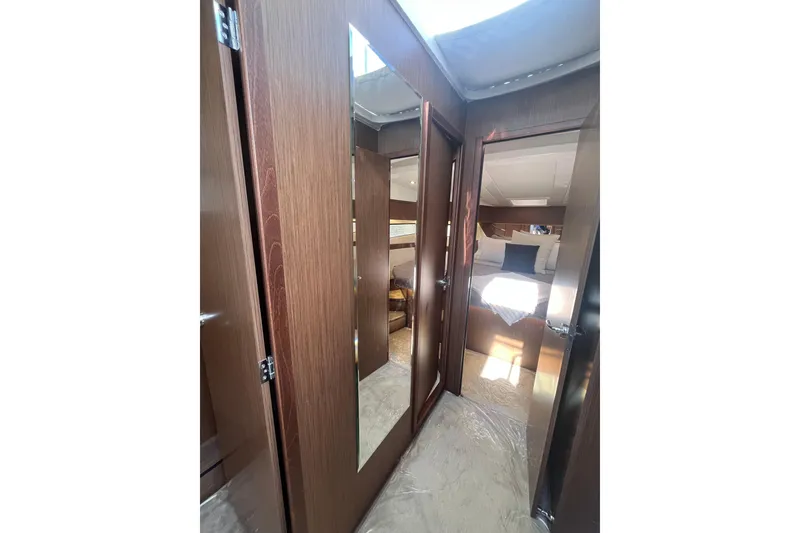 Slide: The Image of Interior of 2026 Beneteau Antares 11 Coupe, featuring elegant wood finishes and cozy cabin. - 25