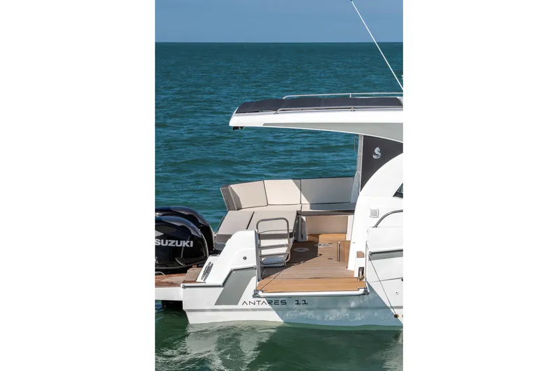 Slide: The Image of 2026 Beneteau Antares 11 Coupe boat on water, featuring spacious deck and Suzuki engine. - 5