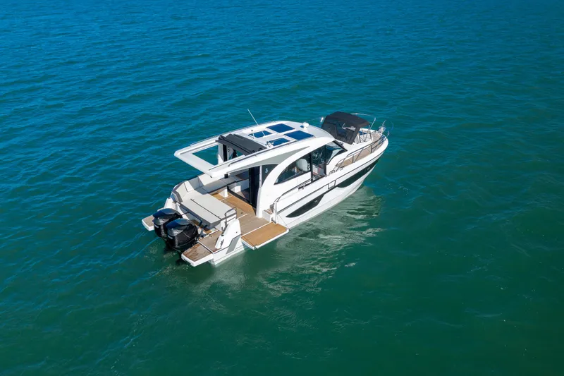 Slide: The Image of 2026 Beneteau Antares 11 Coupe cruising on open water, showcasing sleek design and modern features. - 7