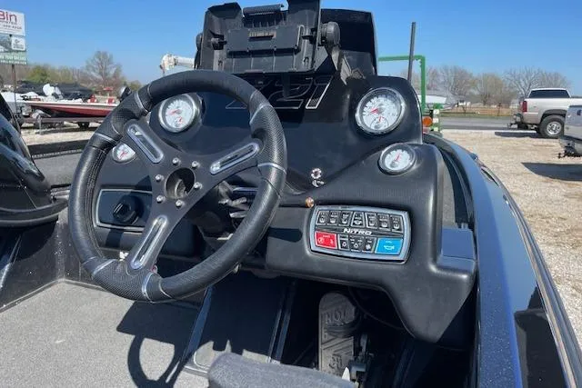 Slide: The Image of 2018 Nitro Z21 boat dashboard with steering wheel and control panel. - 5