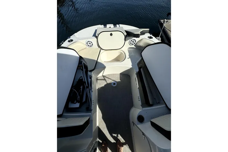Slide: The Image of 2022 Stingray SC192 boat interior with seating and storage compartments. - 24