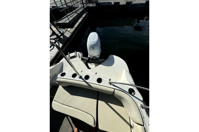 Slide: The Image of 2022 Stingray SC192 boat with outboard motor docked at marina. - 25