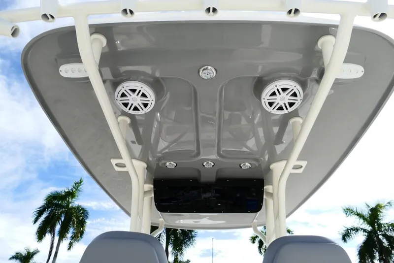 Slide: The Image of 2026 Avenger AV26 boat roof with speakers and lights, set against a palm tree backdrop. - 22