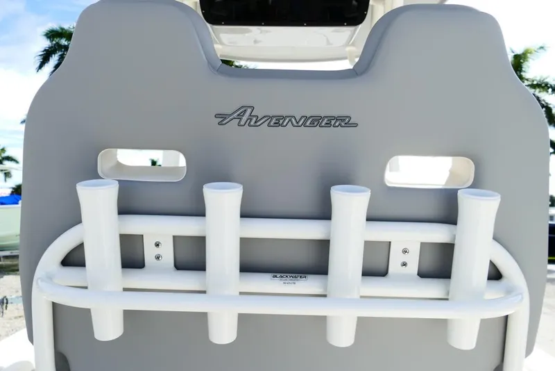 Slide: The Image of 2026 Avenger AV26 boat seat with rod holders, featuring sleek design and branding. - 23