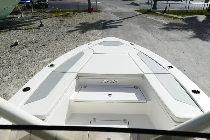Slide: The Image of Avenger AV26 boat deck, 2026 model, parked on gravel lot under sunlight. - 33