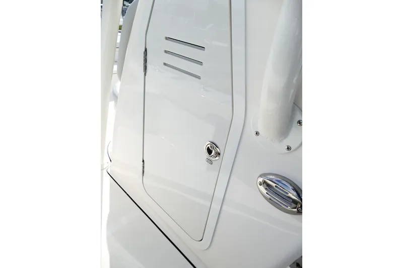 Slide: The Image of Close-up of 2026 Avenger AV26 boat's sleek white exterior with chrome details. - 34